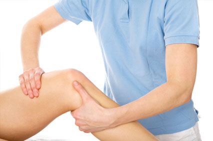 Physiotherapist performing manual therapy on a patient's knee