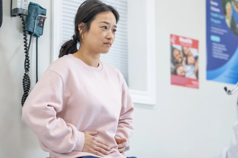 Woman speaking with her practitioner during a consultation