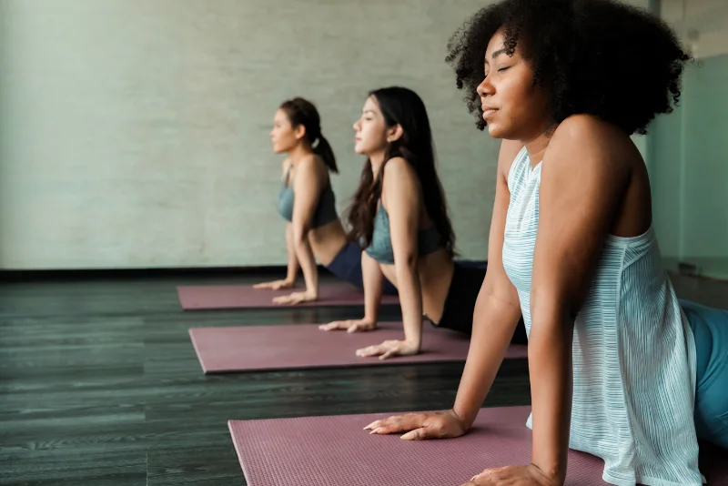 Women stretching together in a yoga class